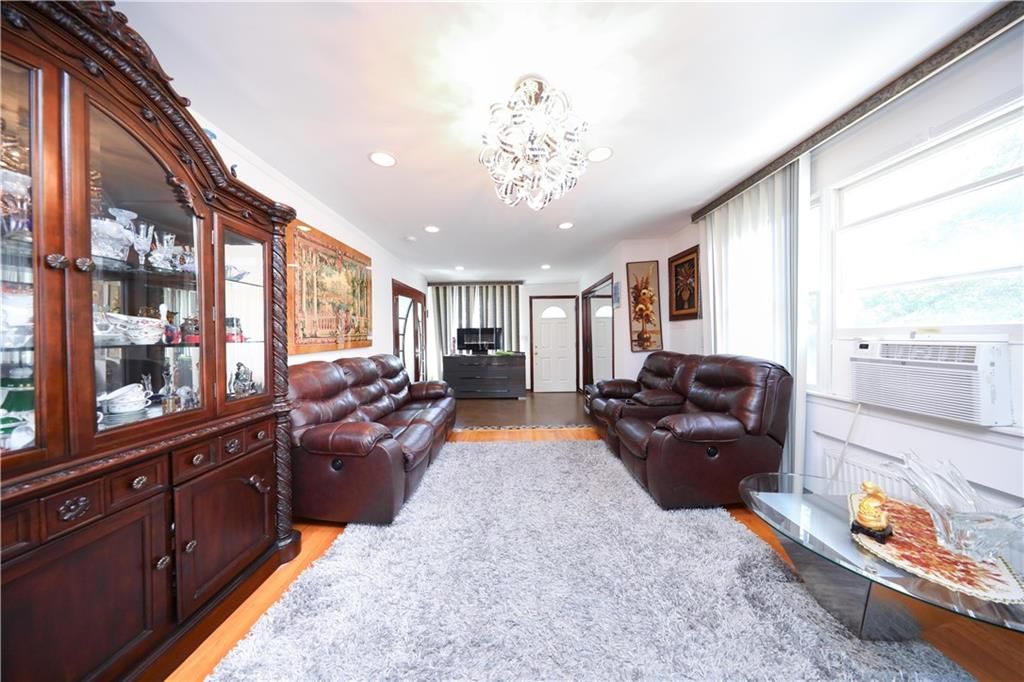 Chandelier, Fireplace, Interior, Living room, Recessed Lighting, Wood Texture Flooring