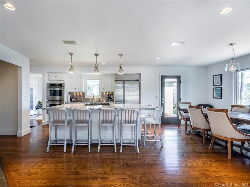Dining room, Interior, Kitchen, Pendant Lights, Recessed Lighting, Stainless Steel Appliances, Wood Texture Flooring