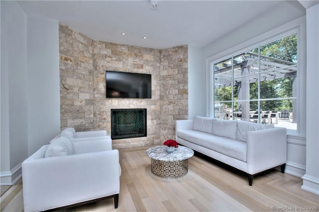 Fireplace, Interior, Living room, Recessed Lighting, Stone Walls, Wood Texture Flooring