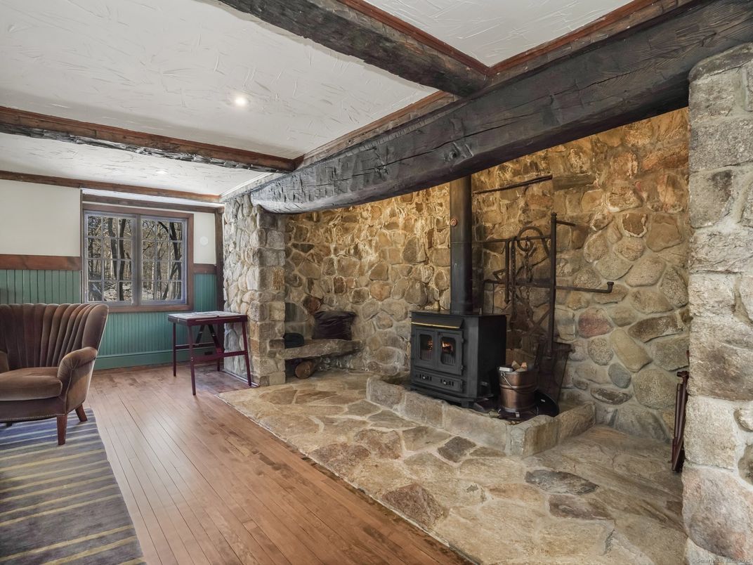 Fireplace, Interior, Recessed Lighting, Stone Walls, Wood Texture Flooring