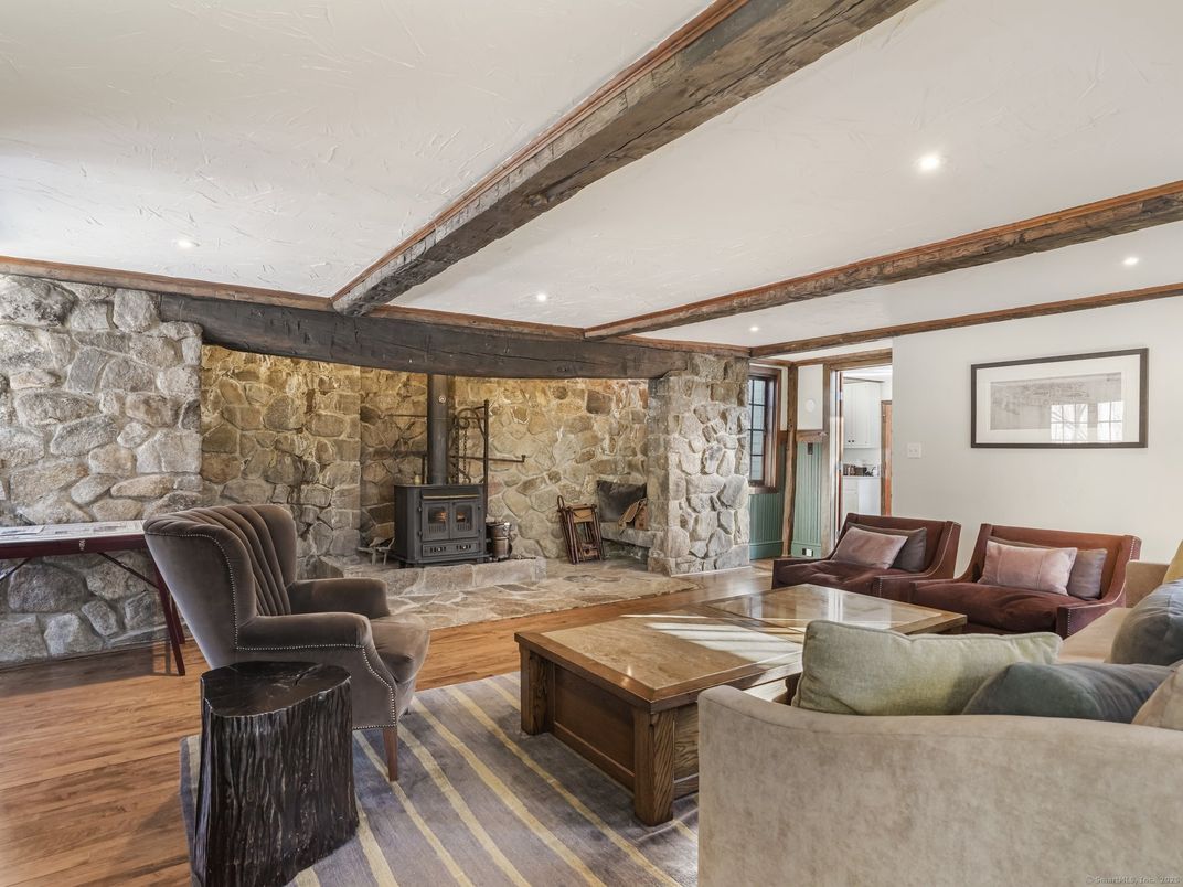 Fireplace, Interior, Living room, Recessed Lighting, Stone Walls, Wood Texture Flooring