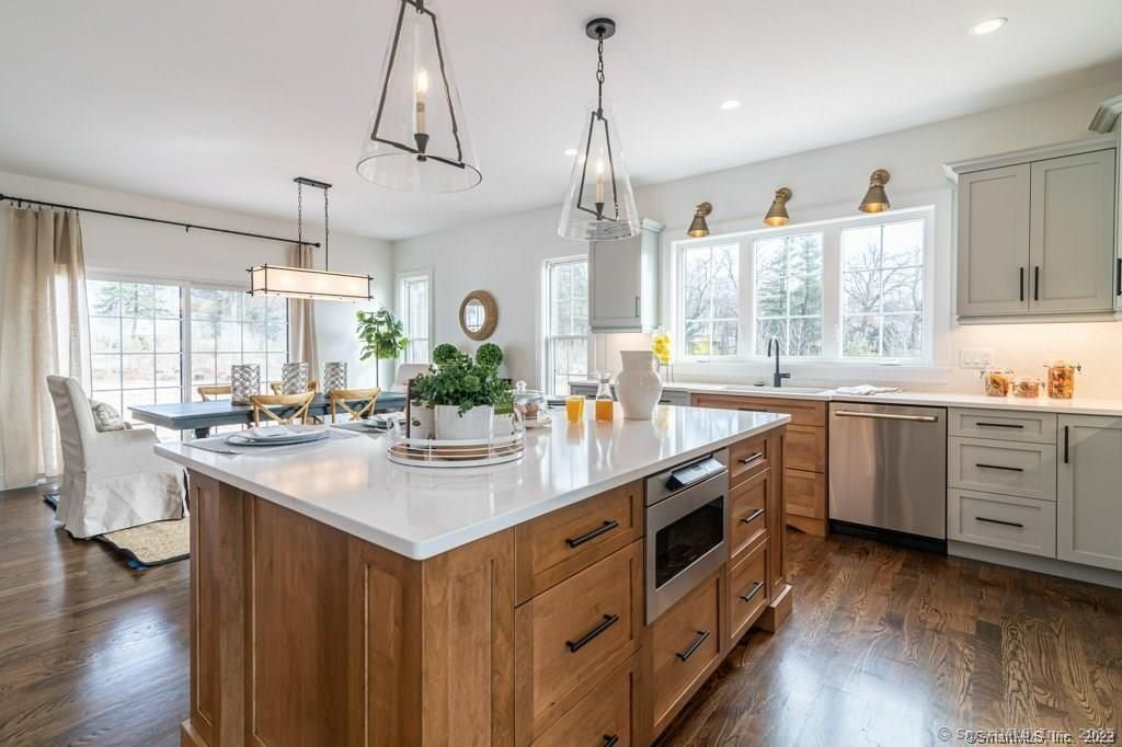 Dining room, Interior, Kitchen, Pendant Lights, Recessed Lighting, Stainless Steel Appliances, Wood Texture Flooring