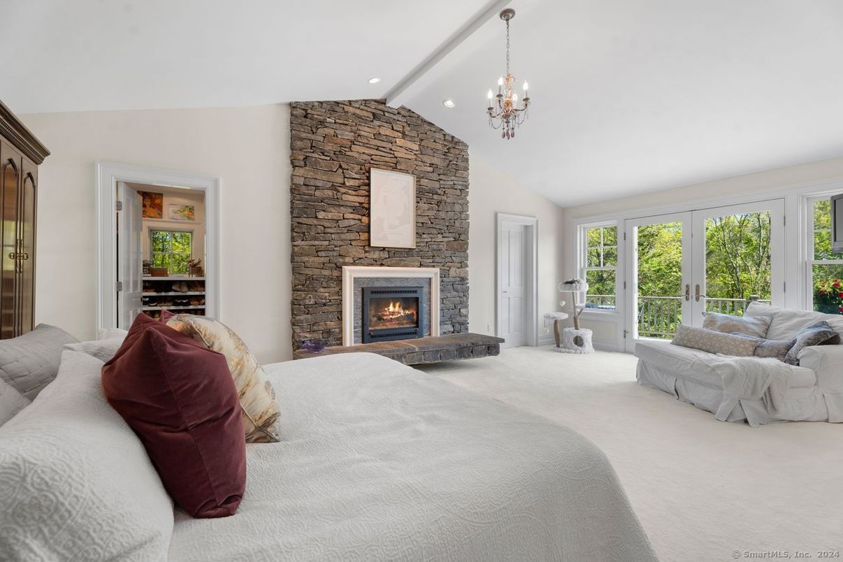 Bedroom, Chandelier, Fireplace, Interior, Recessed Lighting, Stone Walls