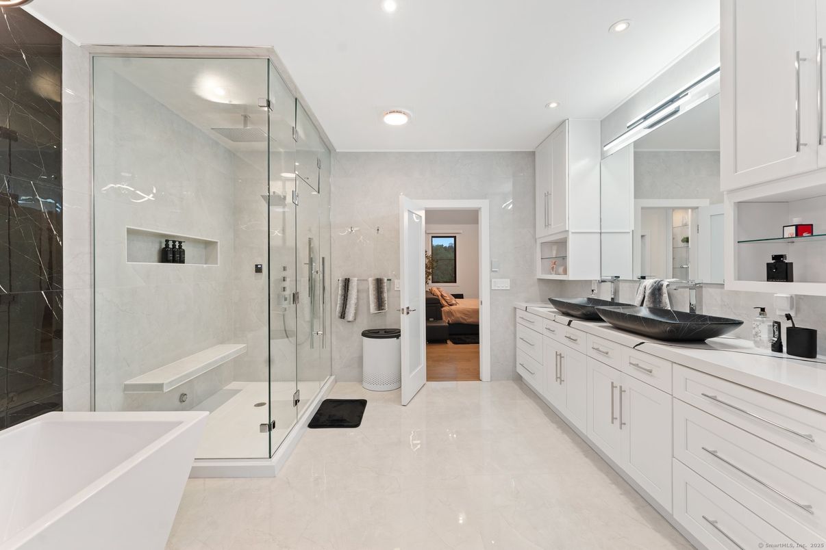 Bathroom, Dual Sink Vanities, Free Standing Baths, Glass Shower, Interior, Recessed Lighting, Wood Texture Flooring