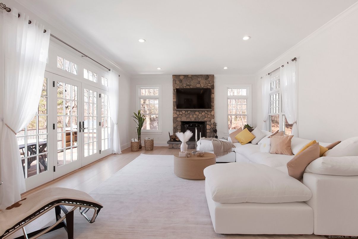 Fireplace, Interior, Living room, Recessed Lighting, Stone Walls, Wood Texture Flooring