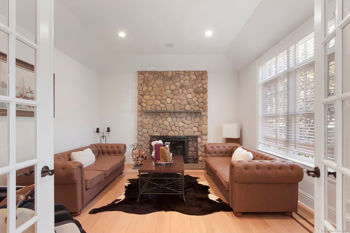 Fireplace, Interior, Living room, Recessed Lighting, Stone Walls, Wood Texture Flooring