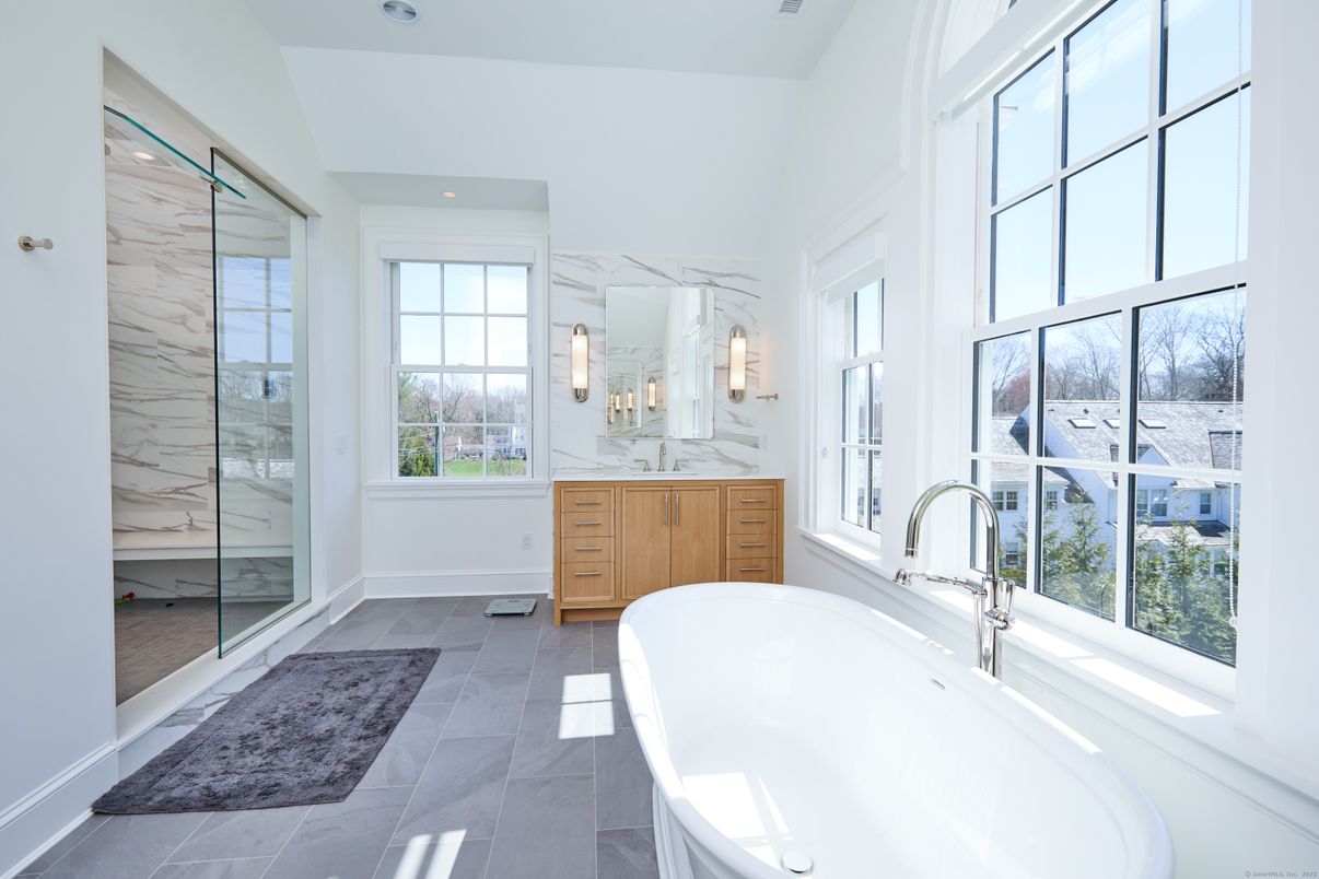 Bathroom, Dual Sink Vanities, Free Standing Baths, Glass Shower, Interior, Marble Walls, Recessed Lighting