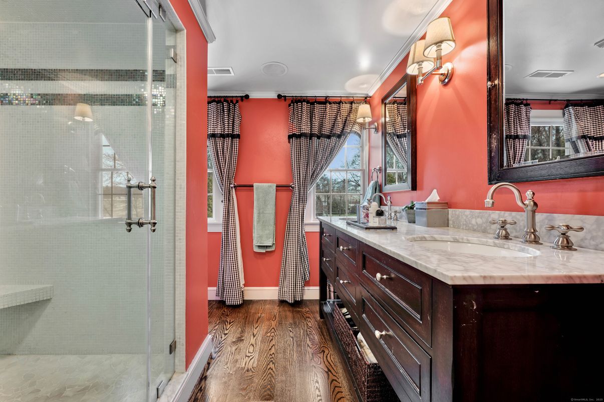 Bathroom, Dual Sink Vanities, Glass Shower, Interior, Recessed Lighting, Wood Texture Flooring