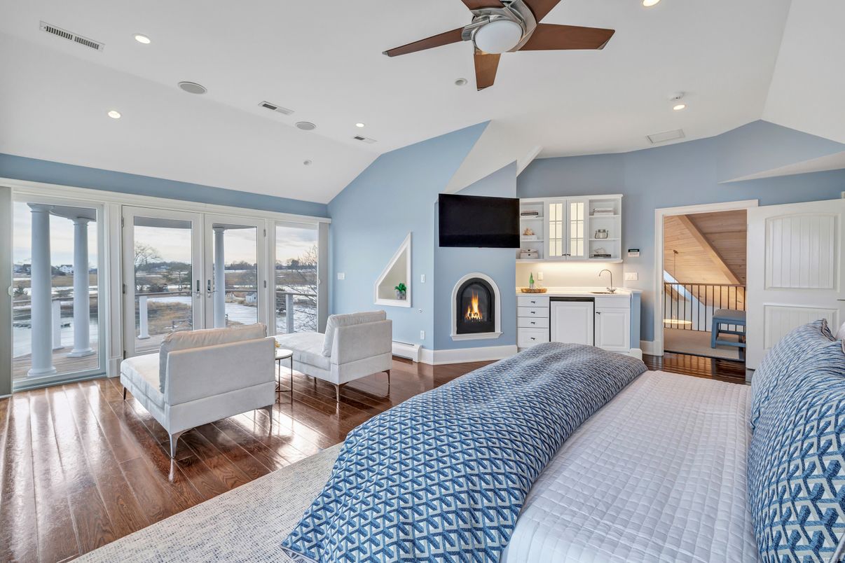 Bedroom, Fireplace, Interior, Recessed Lighting, Water, Wood Texture Flooring
