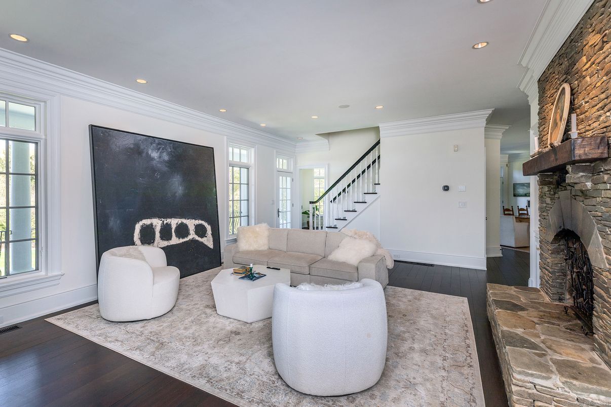 Fireplace, Interior, Living room, Recessed Lighting, Stone Walls, Wood Texture Flooring