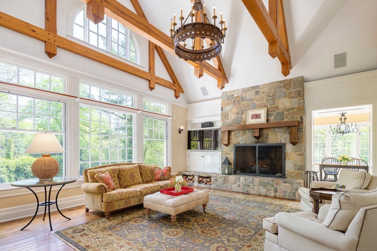 Chandelier, Fireplace, Interior, Living room, Stone Walls, Wooden Beams, Wood Texture Flooring