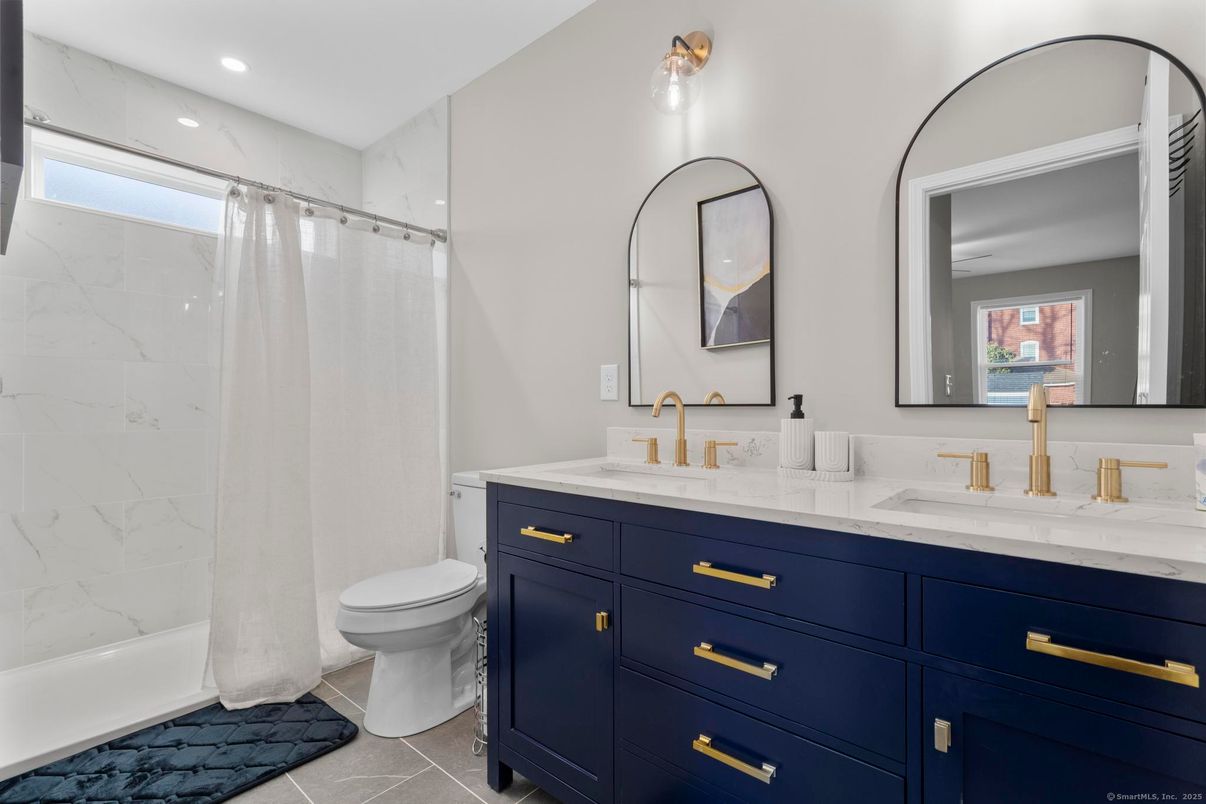 Bathroom, Dual Sink Vanities, Interior, Marble, Marble Walls, Recessed Lighting