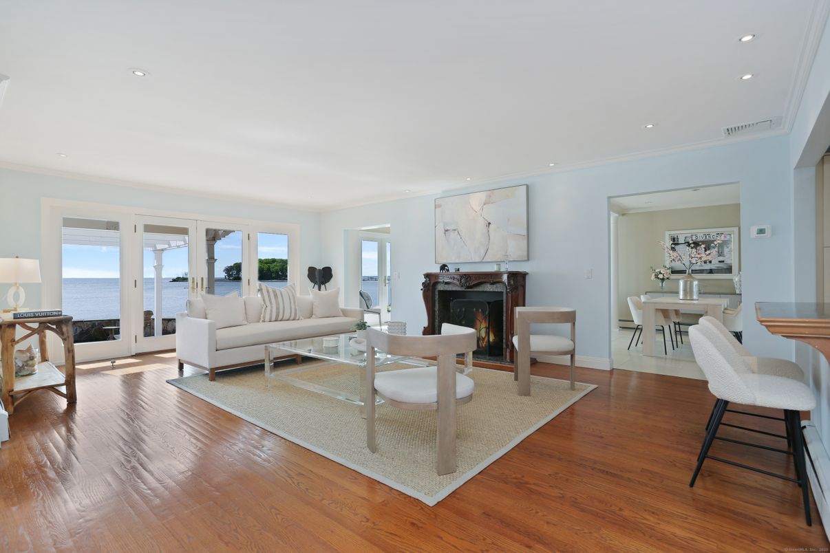 Dining room, Fireplace, Interior, Living room, Recessed Lighting, Water, Wood Texture Flooring