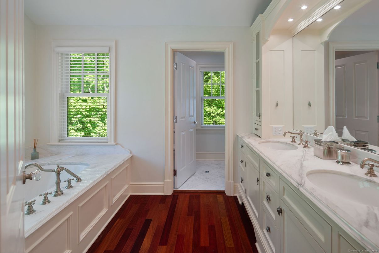 Bathroom, Dual Sink Vanities, Interior, Marble, Recessed Lighting, Wood Texture Flooring