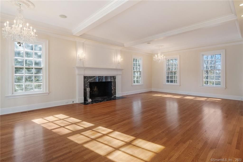Chandelier, Empty room, Fireplace, Interior, Recessed Lighting, Wood Texture Flooring