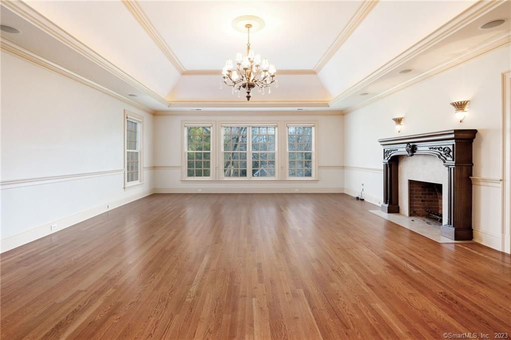 Chandelier, Empty room, Fireplace, Interior, Recessed Lighting, Wood Texture Flooring