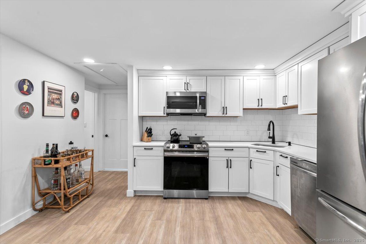 Interior, Kitchen, Recessed Lighting, Stainless Steel Appliances, Wood Texture Flooring