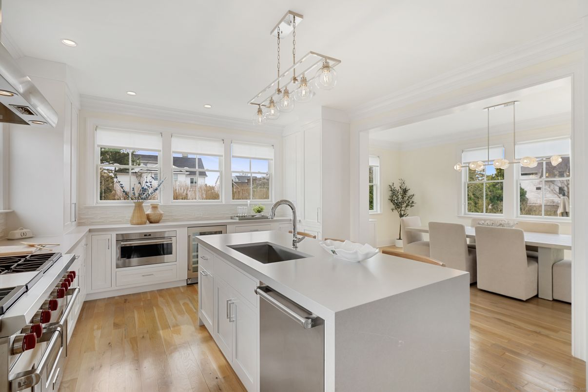 Dining room, Interior, Kitchen, Pendant Lights, Recessed Lighting, Stainless Steel Appliances, Wood Texture Flooring