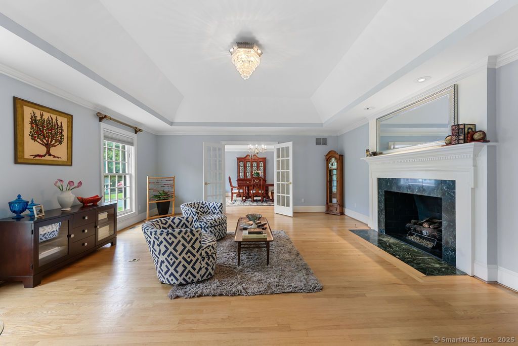 Chandelier, Dining room, Fireplace, Interior, Living room, Recessed Lighting, Wood Texture Flooring