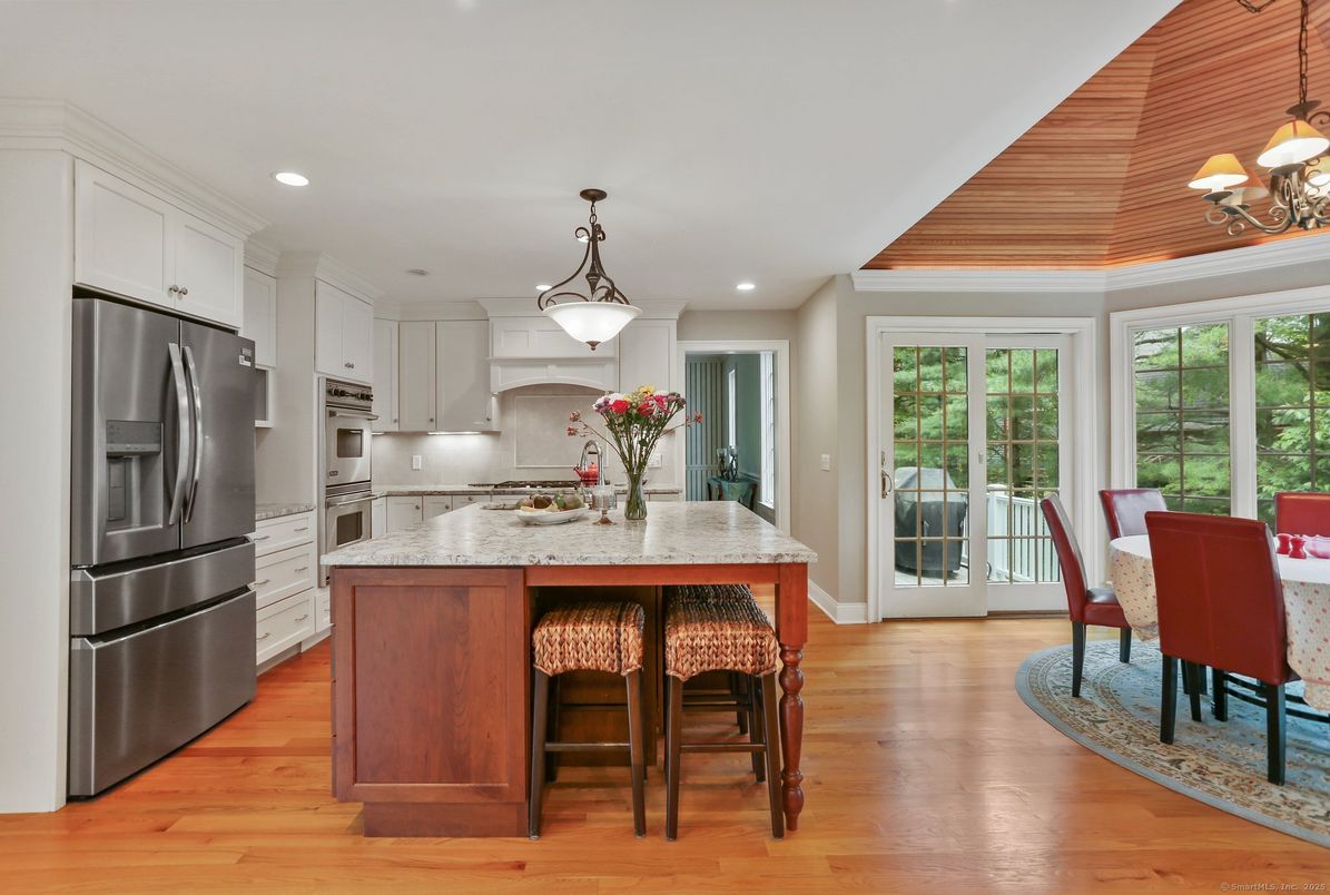 Chandelier, Dining room, Interior, Kitchen, Pendant Lights, Recessed Lighting, Stainless Steel Appliances, Wood Texture Flooring