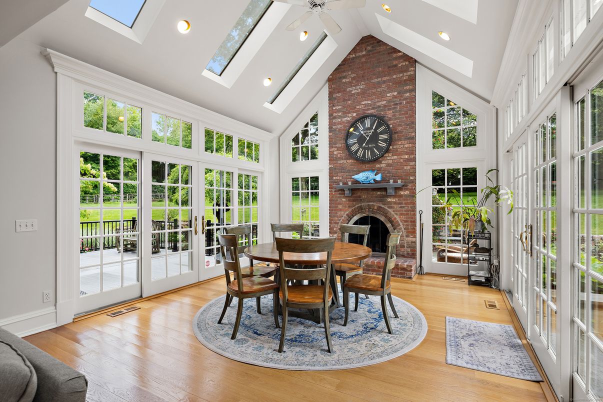 Dining room, Fireplace, Glass Ceilings, Interior, Recessed Lighting, Stone Walls, Sun Room, Wood Texture Flooring