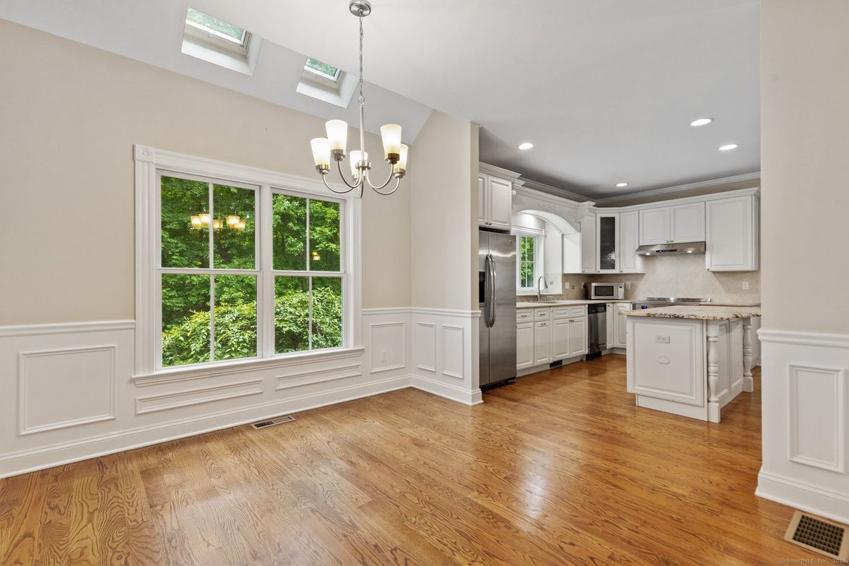 Chandelier, Interior, Kitchen, Pendant Lights, Recessed Lighting, Stainless Steel Appliances, Wood Texture Flooring