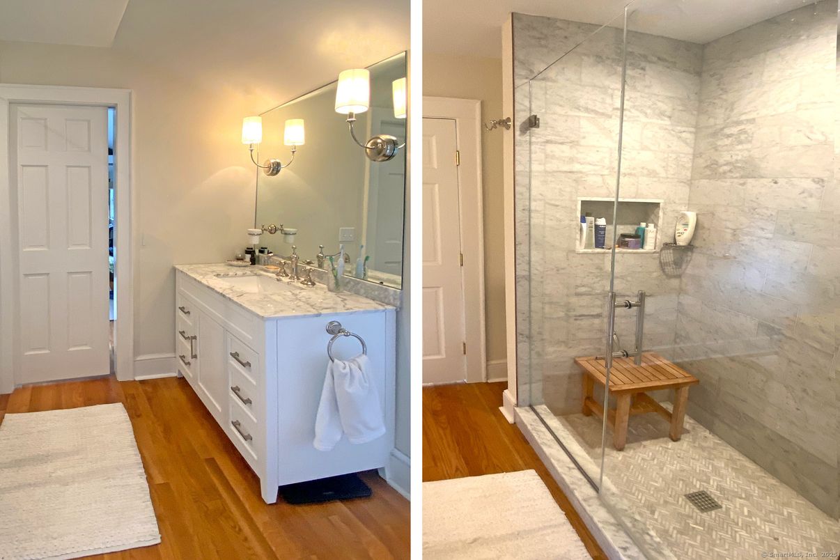 Bathroom, Dual Sink Vanities, Glass Shower, Interior, Marble Walls, Wood Texture Flooring