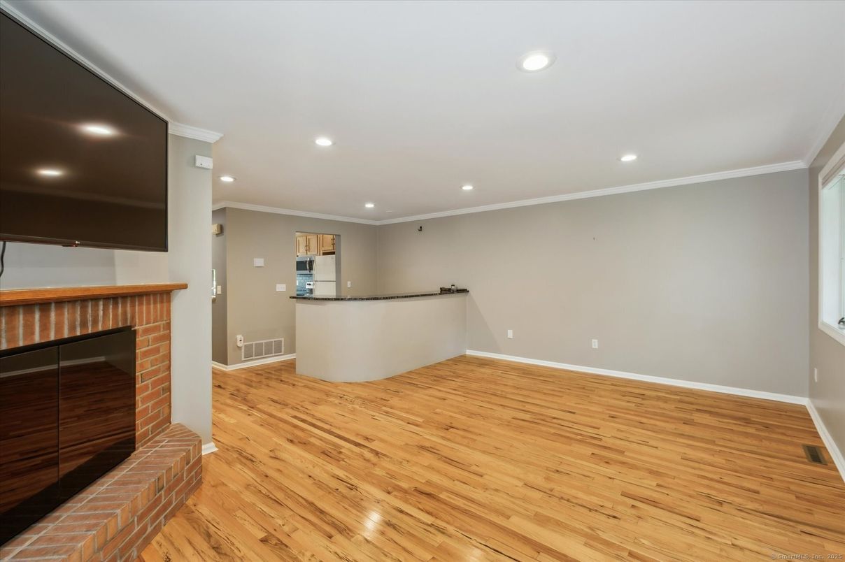 Empty room, Fireplace, Interior, Recessed Lighting, Wood Texture Flooring