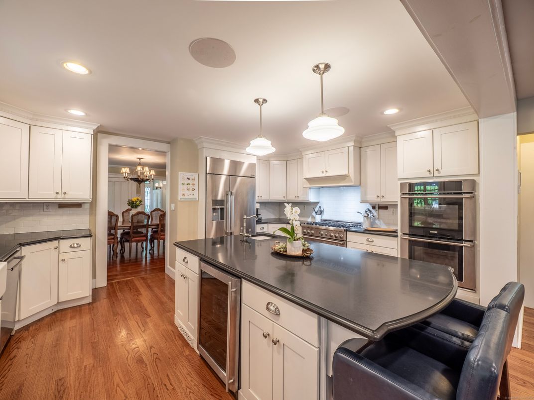 Chandelier, Dining room, Interior, Kitchen, Pendant Lights, Recessed Lighting, Stainless Steel Appliances, Wood Texture Flooring