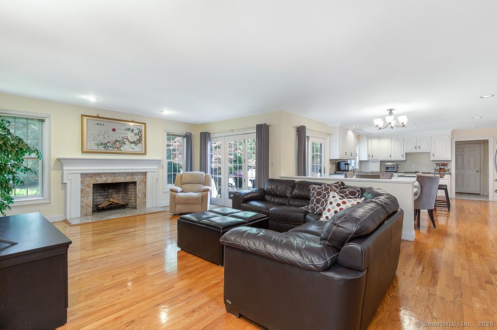 Chandelier, Fireplace, Interior, Kitchen, Living room, Recessed Lighting, Wood Texture Flooring