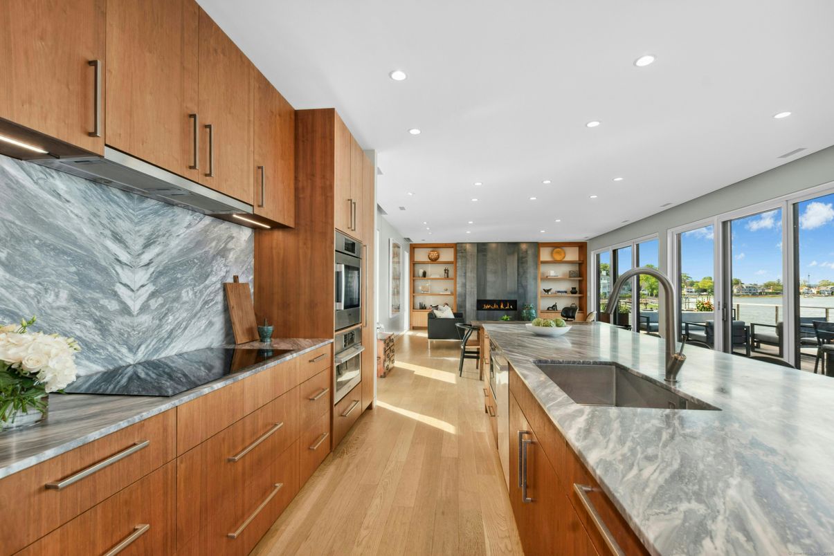 Interior, Kitchen, Marble Walls, Recessed Lighting, Stainless Steel Appliances, Water, Wood Texture Flooring
