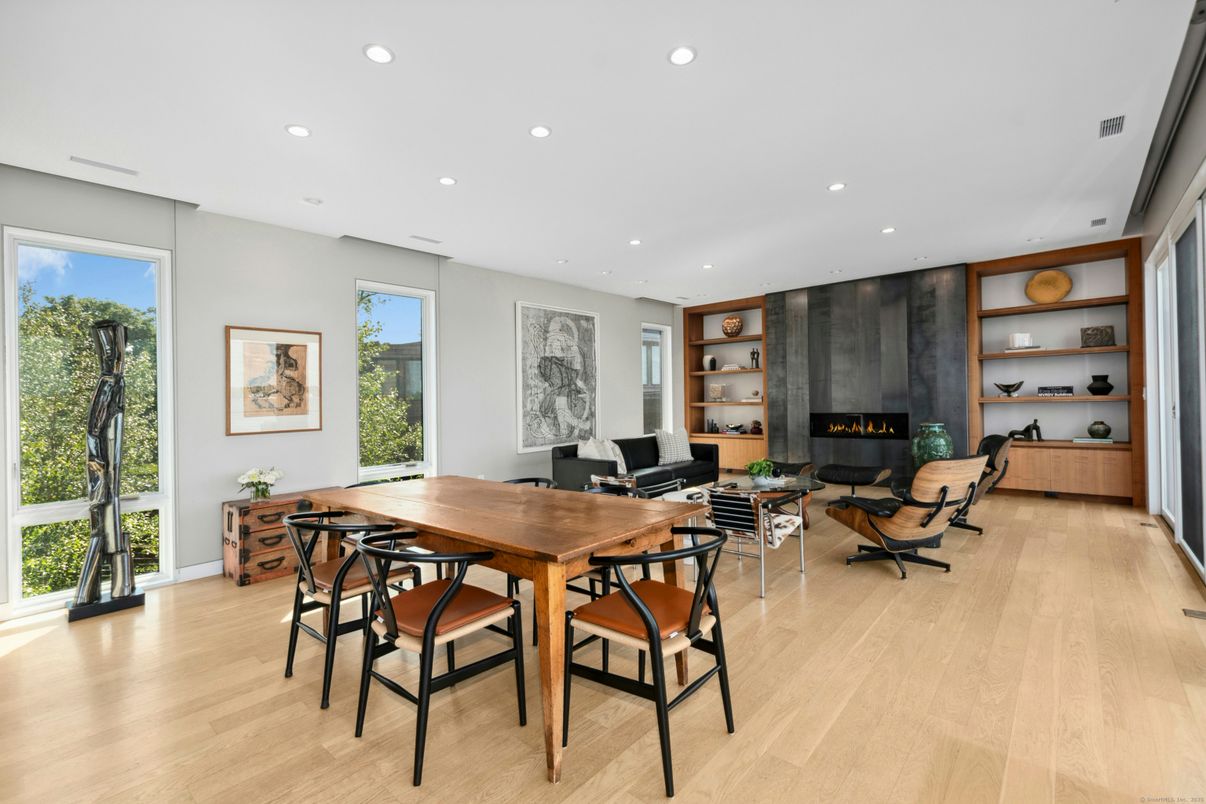 Dining room, Fireplace, Interior, Living room, Recessed Lighting, Wood Texture Flooring