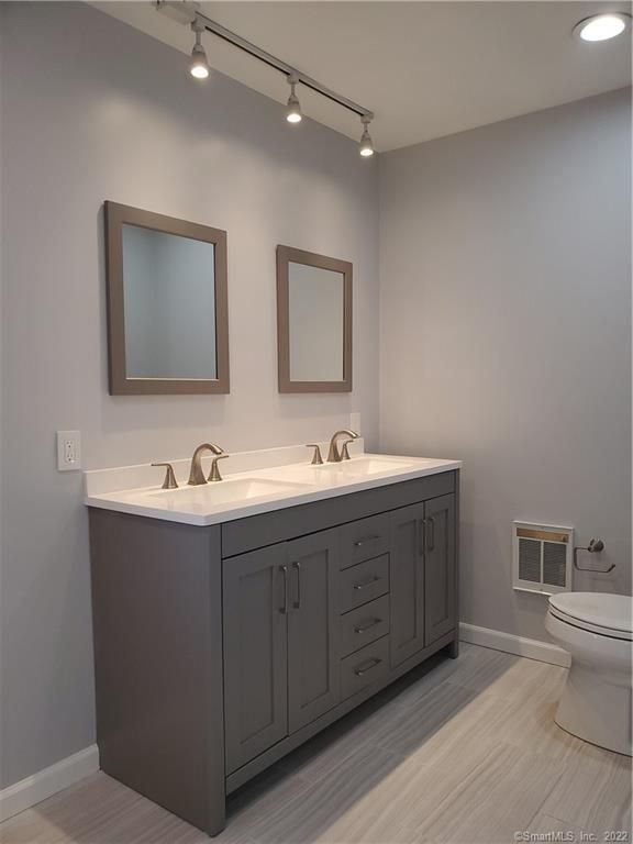 Bathroom, Dual Sink Vanities, Interior, Recessed Lighting, Wood Texture Flooring