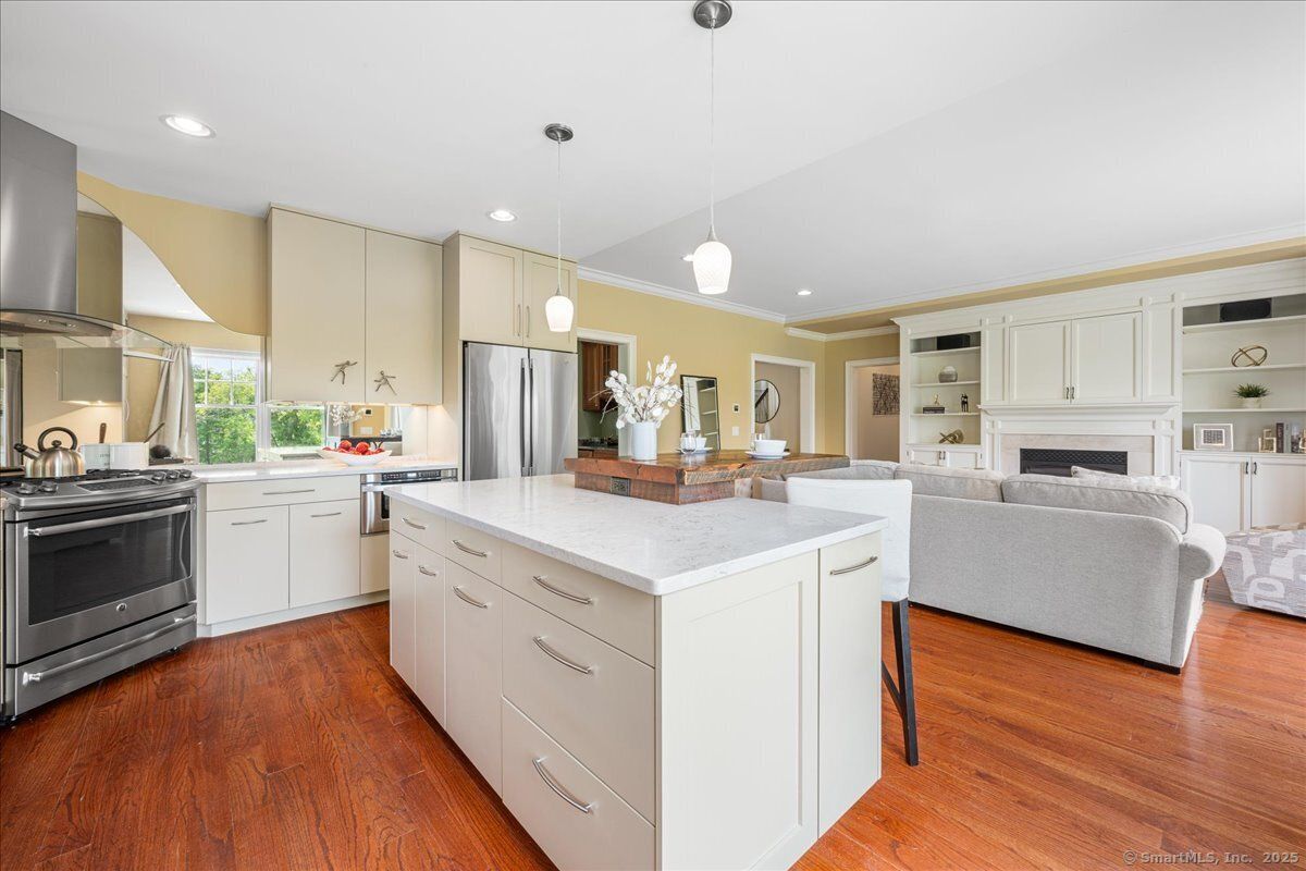 Fireplace, Interior, Kitchen, Pendant Lights, Recessed Lighting, Stainless Steel Appliances, Wood Texture Flooring