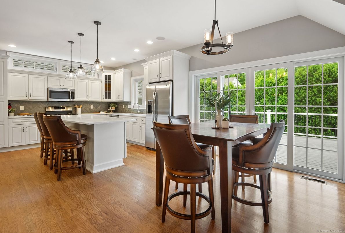 Dining room, Interior, Kitchen, Pendant Lights, Recessed Lighting, Stainless Steel Appliances, Wood Texture Flooring