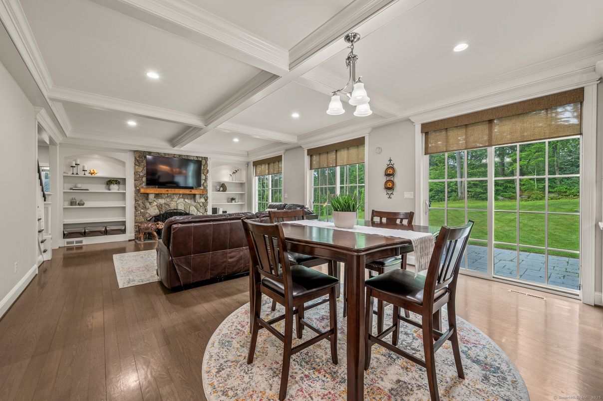Dining room, Fireplace, Interior, Living room, Pendant Lights, Recessed Lighting, Wood Texture Flooring