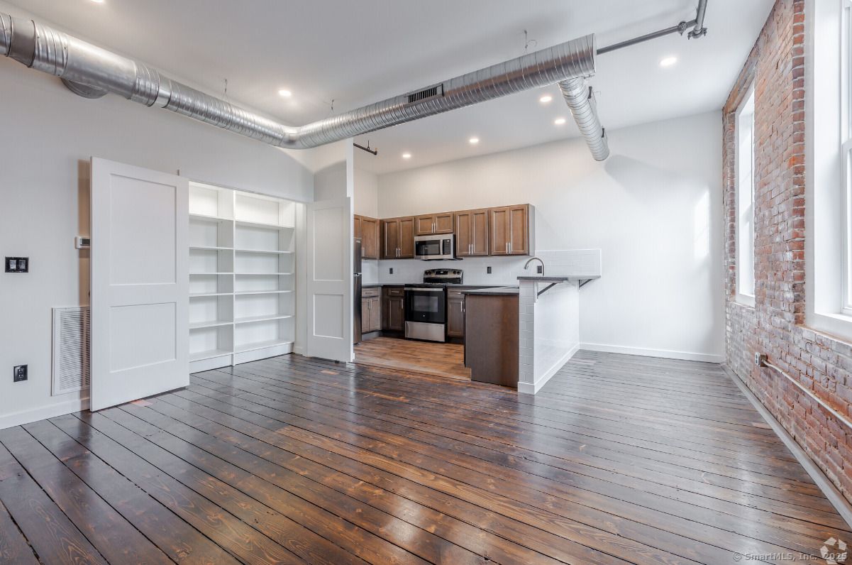 Interior, Kitchen, Recessed Lighting, Stainless Steel Appliances, Stone Walls, Wood Texture Flooring