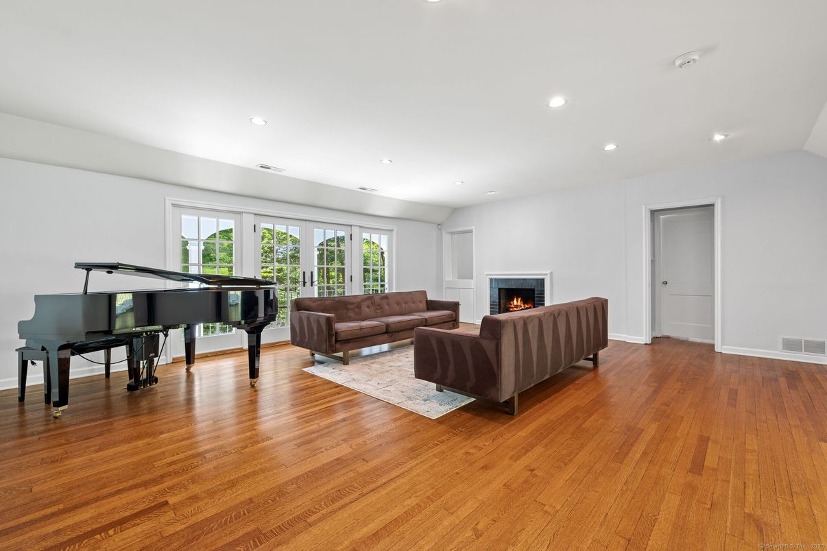 Fireplace, Interior, Living room, Piano, Recessed Lighting, Wood Texture Flooring