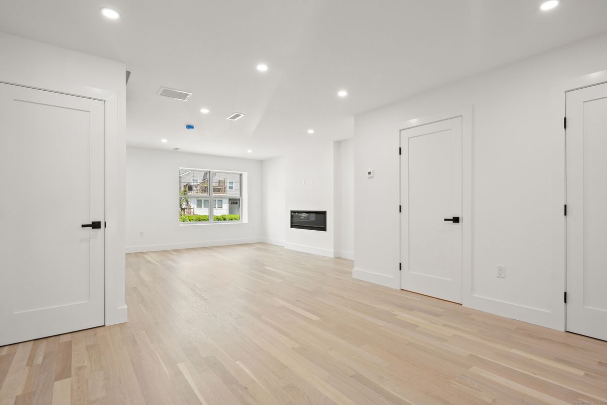 Empty room, Fireplace, Interior, Recessed Lighting, Wood Texture Flooring
