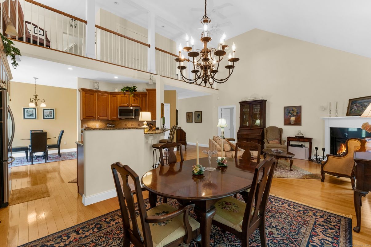 Chandelier, Dining room, Fireplace, Interior, Living room, Recessed Lighting, Wood Texture Flooring