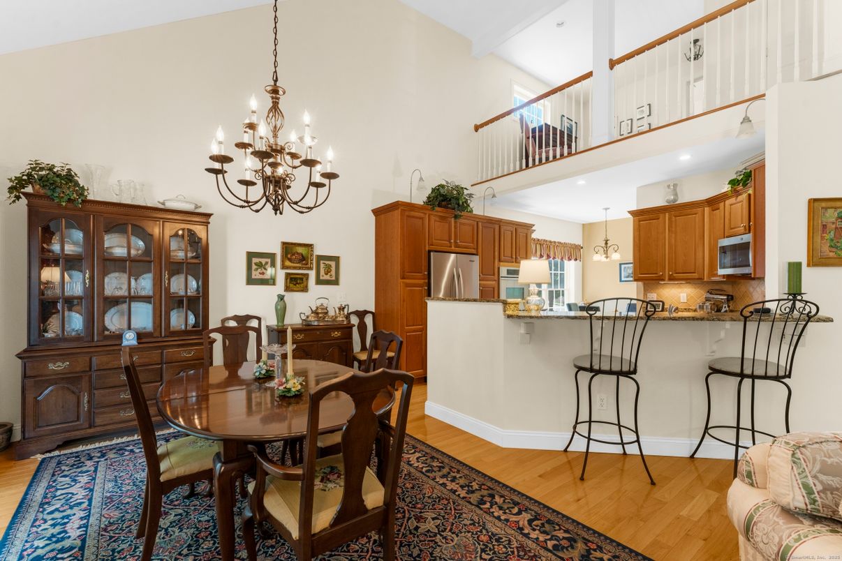 Chandelier, Dining room, Interior, Kitchen, Recessed Lighting, Stainless Steel Appliances, Wood Texture Flooring