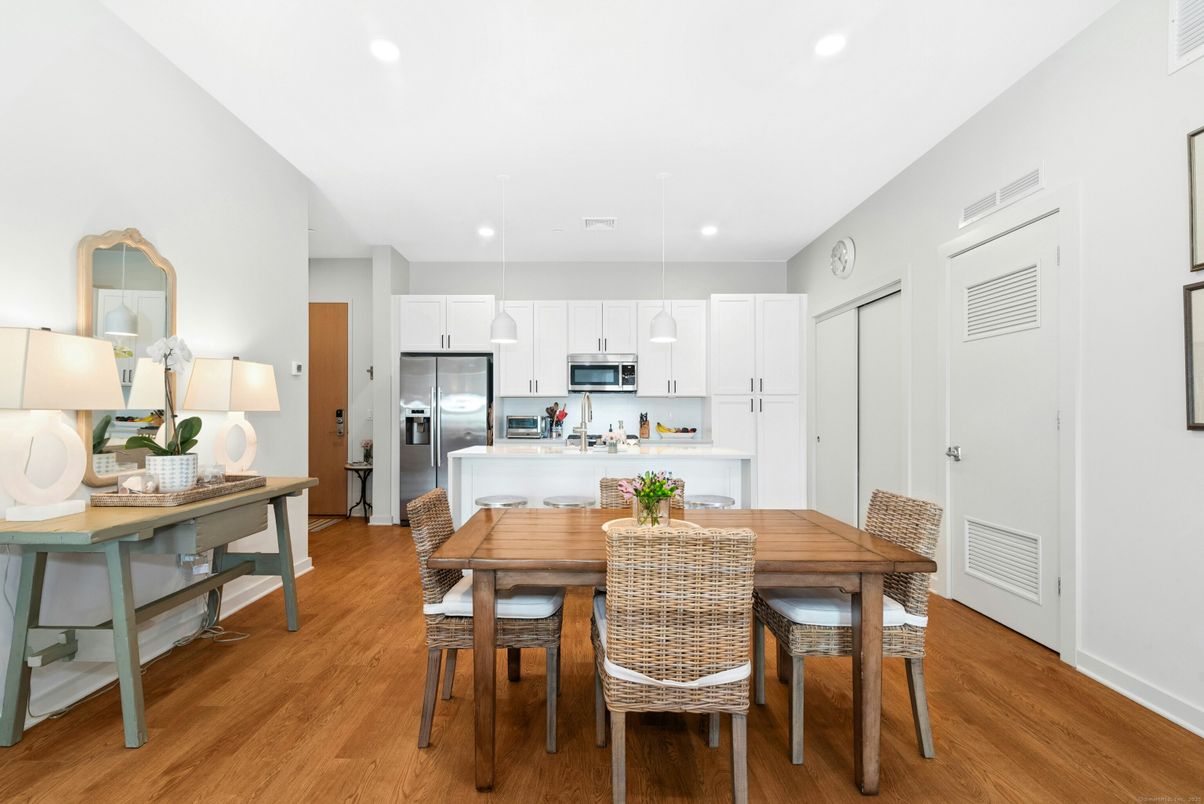 Dining room, Interior, Kitchen, Pendant Lights, Recessed Lighting, Stainless Steel Appliances, Wood Texture Flooring