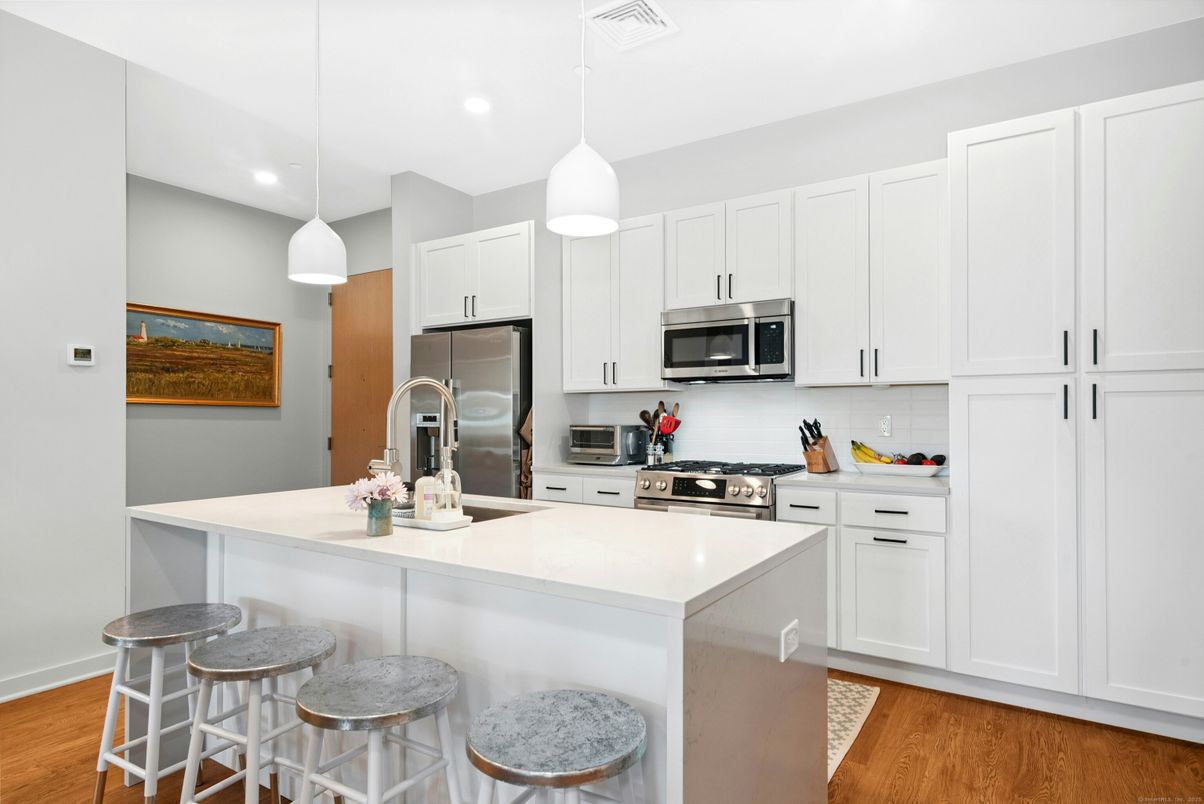 Interior, Kitchen, Pendant Lights, Recessed Lighting, Stainless Steel Appliances, Wood Texture Flooring