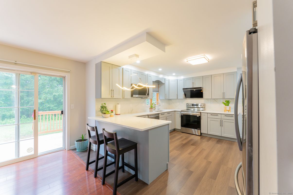 Interior, Kitchen, Marble Walls, Stainless Steel Appliances, Wood Texture Flooring