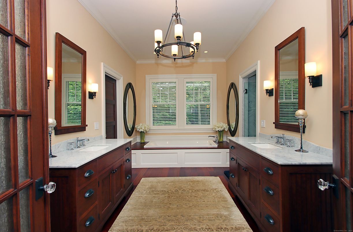 Bathroom, Chandelier, Dual Sink Vanities, Interior, Wood Texture Flooring