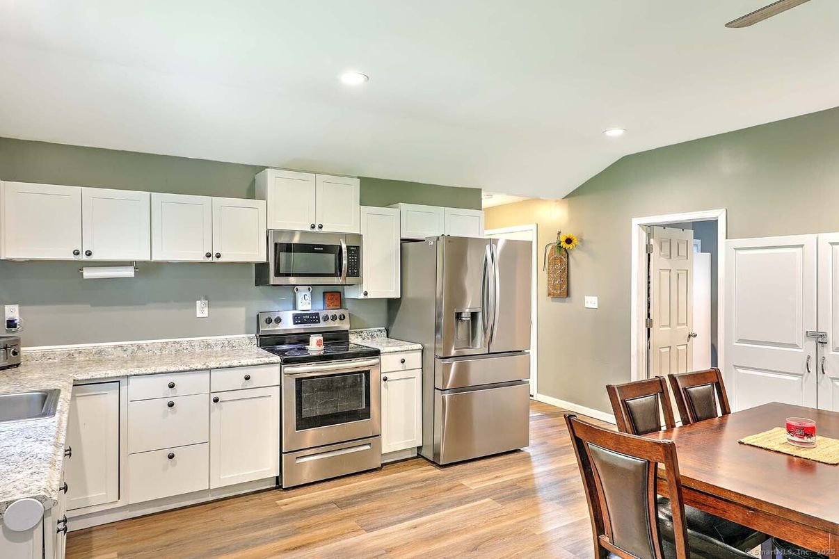Dining room, Interior, Kitchen, Recessed Lighting, Stainless Steel Appliances, Wood Texture Flooring