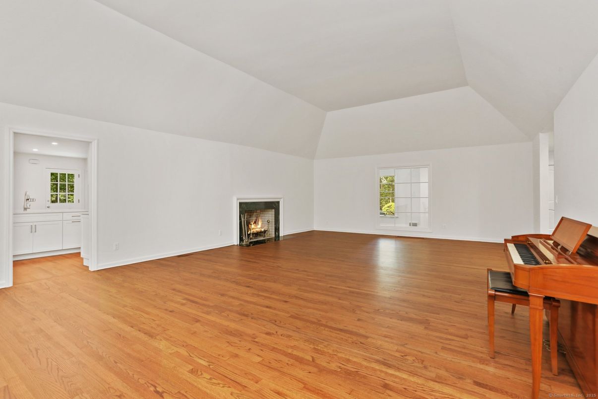Empty room, Fireplace, Interior, Piano, Recessed Lighting, Wood Texture Flooring