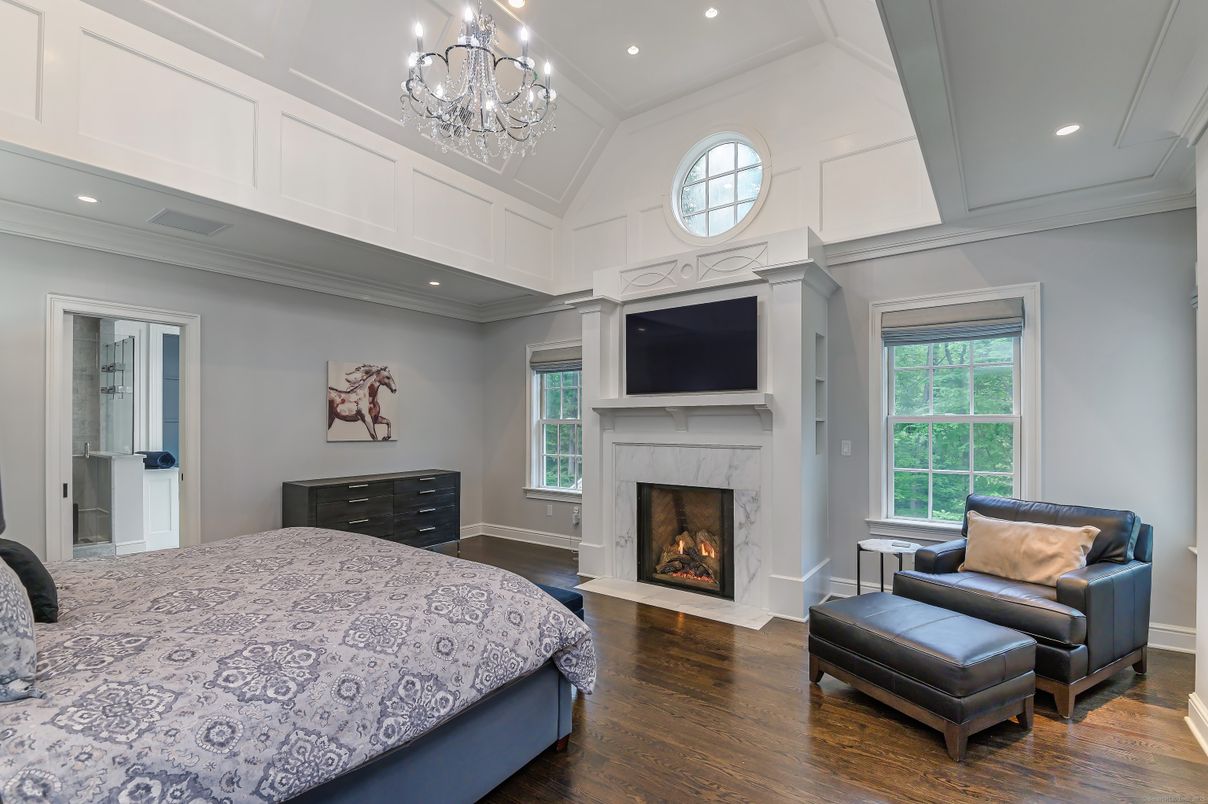 Bedroom, Chandelier, Fireplace, Interior, Recessed Lighting, Wood Texture Flooring