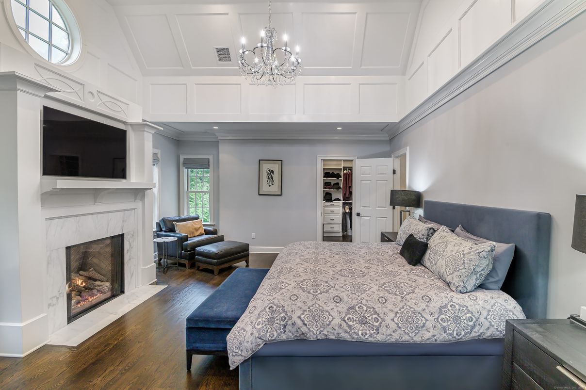 Bedroom, Chandelier, Fireplace, Interior, Recessed Lighting, Wood Texture Flooring