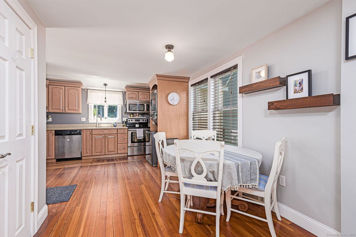 Dining room, Interior, Kitchen, Pendant Lights, Stainless Steel Appliances, Wood Texture Flooring